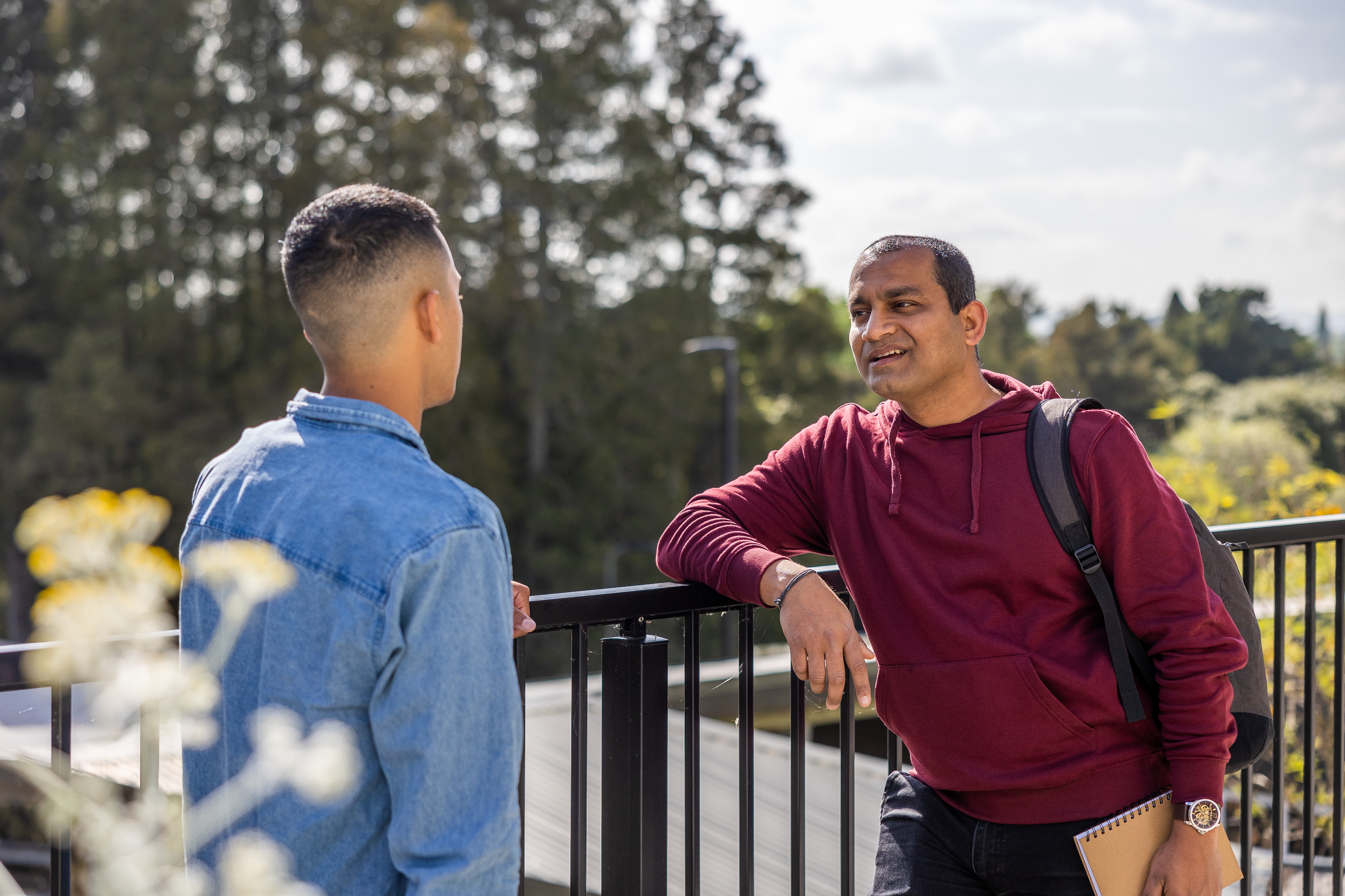 two-students-having-discussion-outside