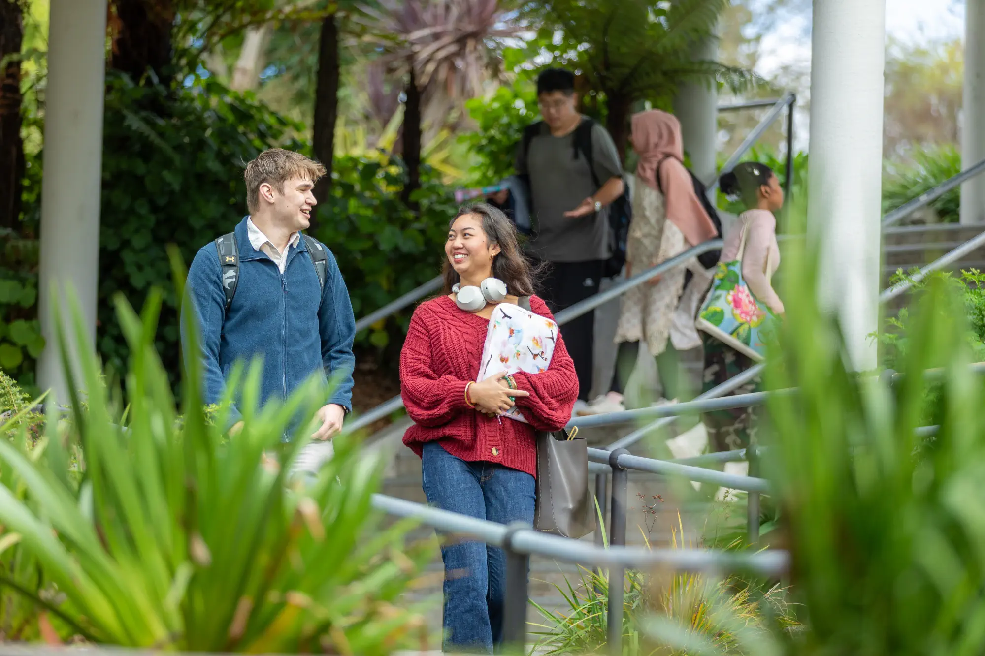students-walking-through-planted-area